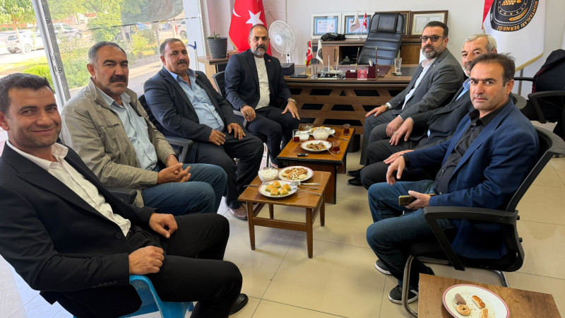 BAŞARAN'DAN MUHTARLARA KUTLAMA